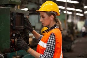 Woman Operating a CNC Machine