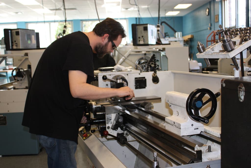 Man working on a CNC machine