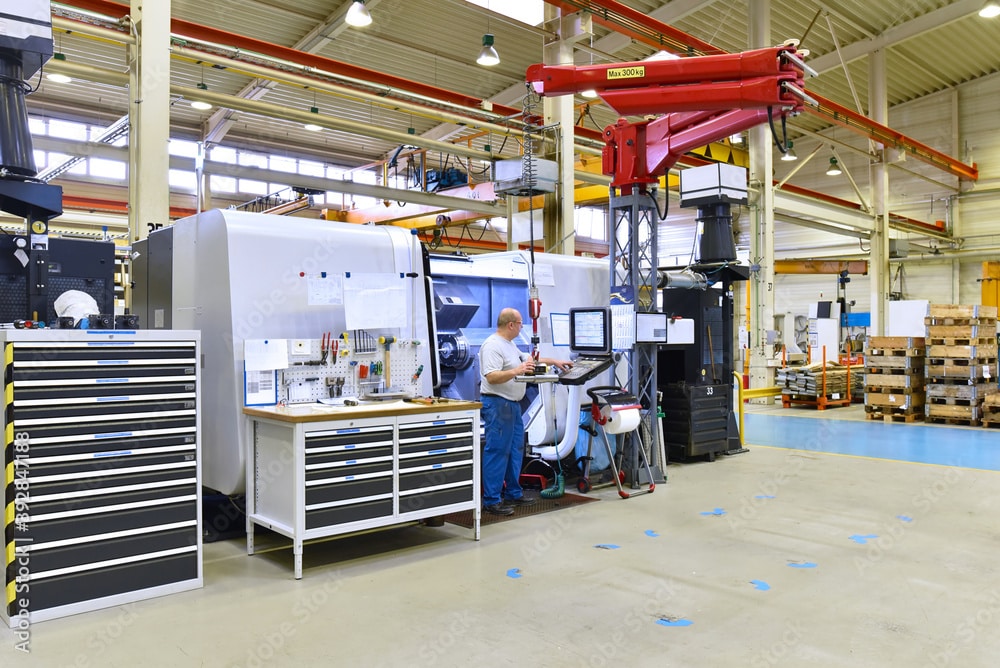 Man standing in CNC machine shop