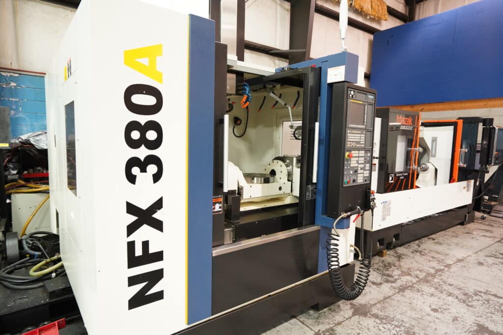 a large cnc machine with a large door