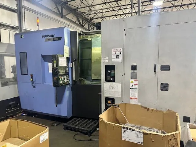 DOOSAN NHP 5000 CNC 4 AXIS HORIZONTAL MACHINING CENTER WITH 12 LINEAR PALLET SYSTEM AND CONTROLLER